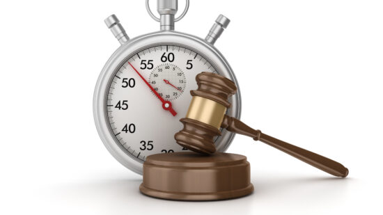 Stopwatch with Gavel on White Background